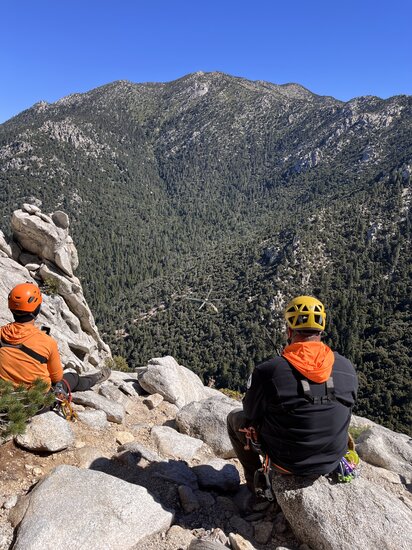 Rescuers watching a helicopter below them